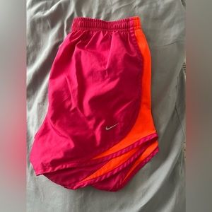 Pink and orange Nike shorts